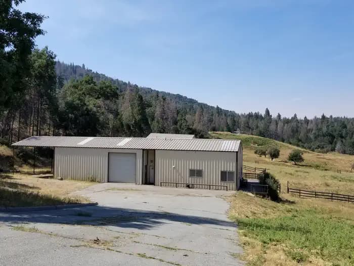 Exterior view of the metal workshop and attached caretaker's apartment. 