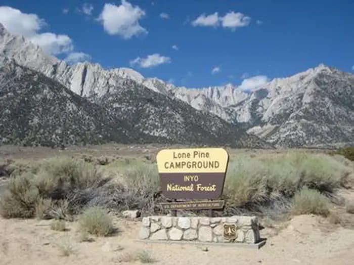 A brown and yellow Forest Service sign for Lone Pine Campground