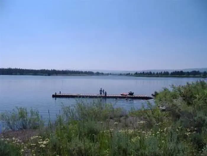 Docks on Hebgen Lake with boat and fishermen