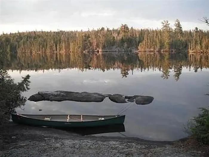 BWCAW Canoe on side of lake