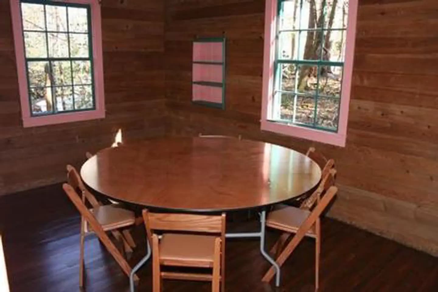 SPENCE CABIN with table and chairs in side room