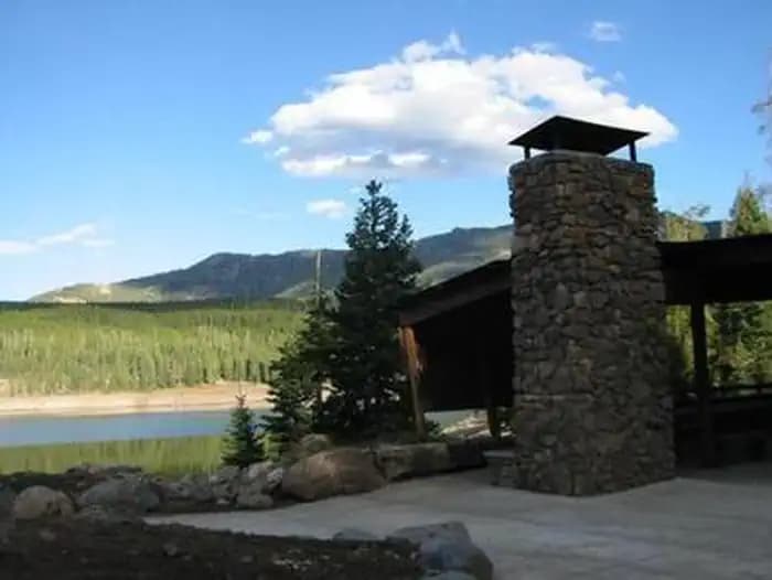 Hyalite Pavilion, fireplace, picnic tables, pine trees, Hyalite Reservoir and mountains