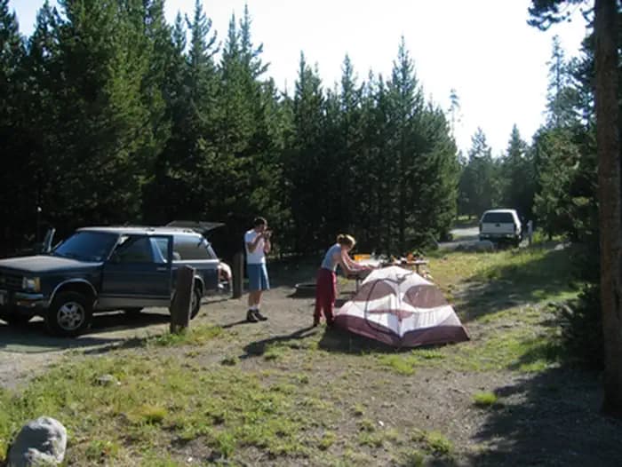 Two campers set up a tent at Indian Creek Campground