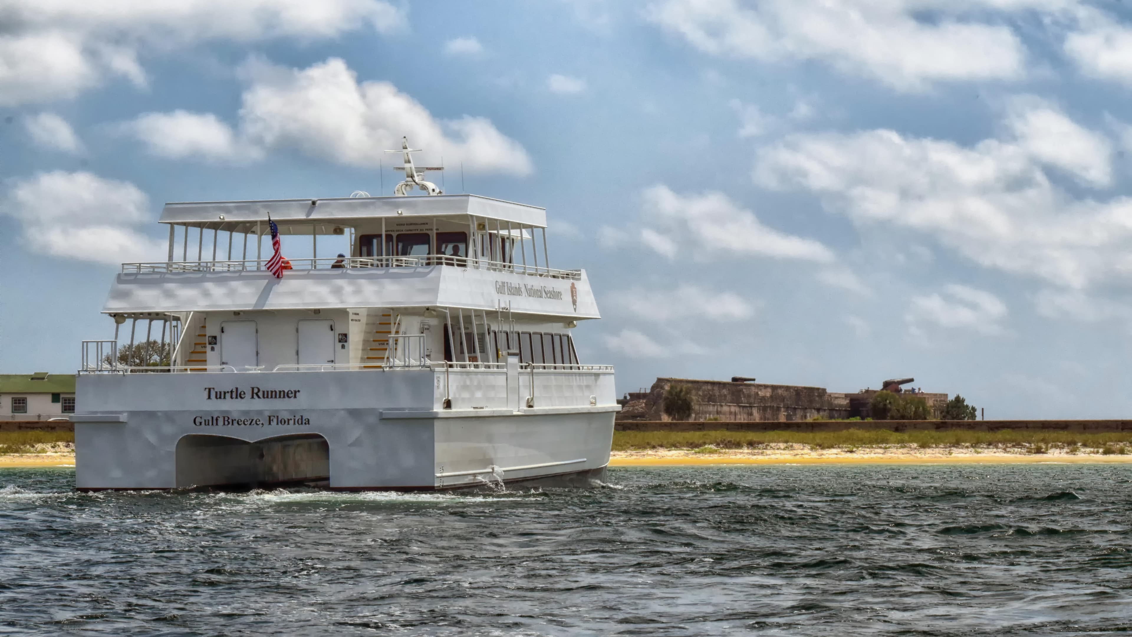 A National Park Service ferry navigates the Pensacola Bay to Fort Pickens.