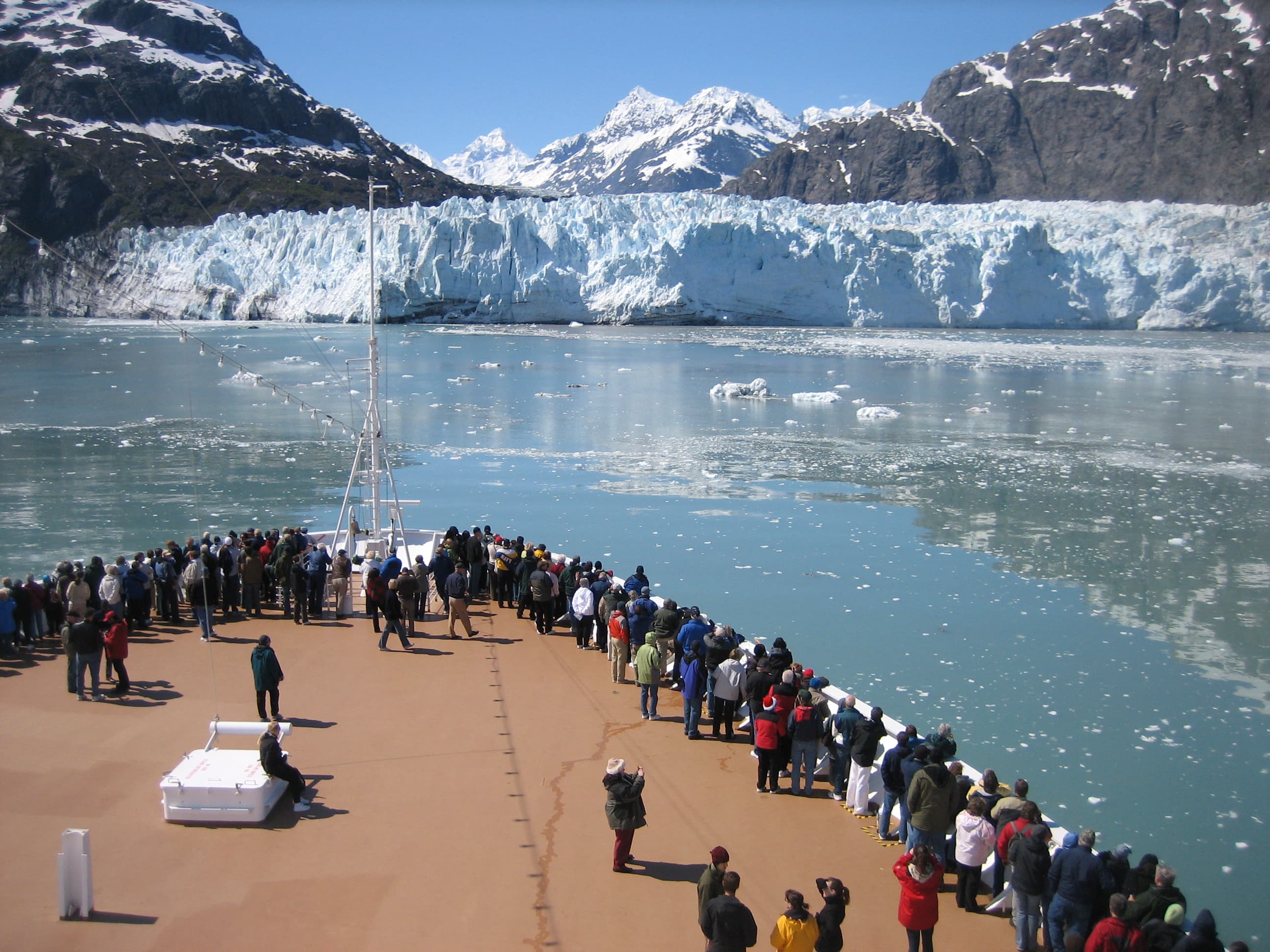 Passengers line the deck to enjoy the icy scene at Margerie Glacier