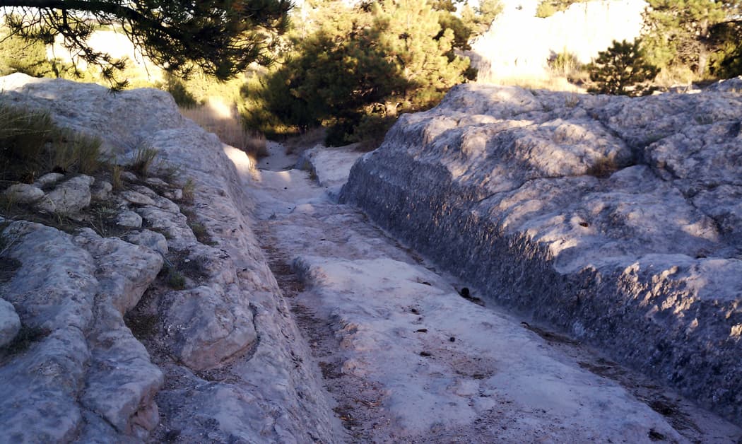 The Guernsey Ruts in Wyoming feature deeply eroded rock from wagon traffic.