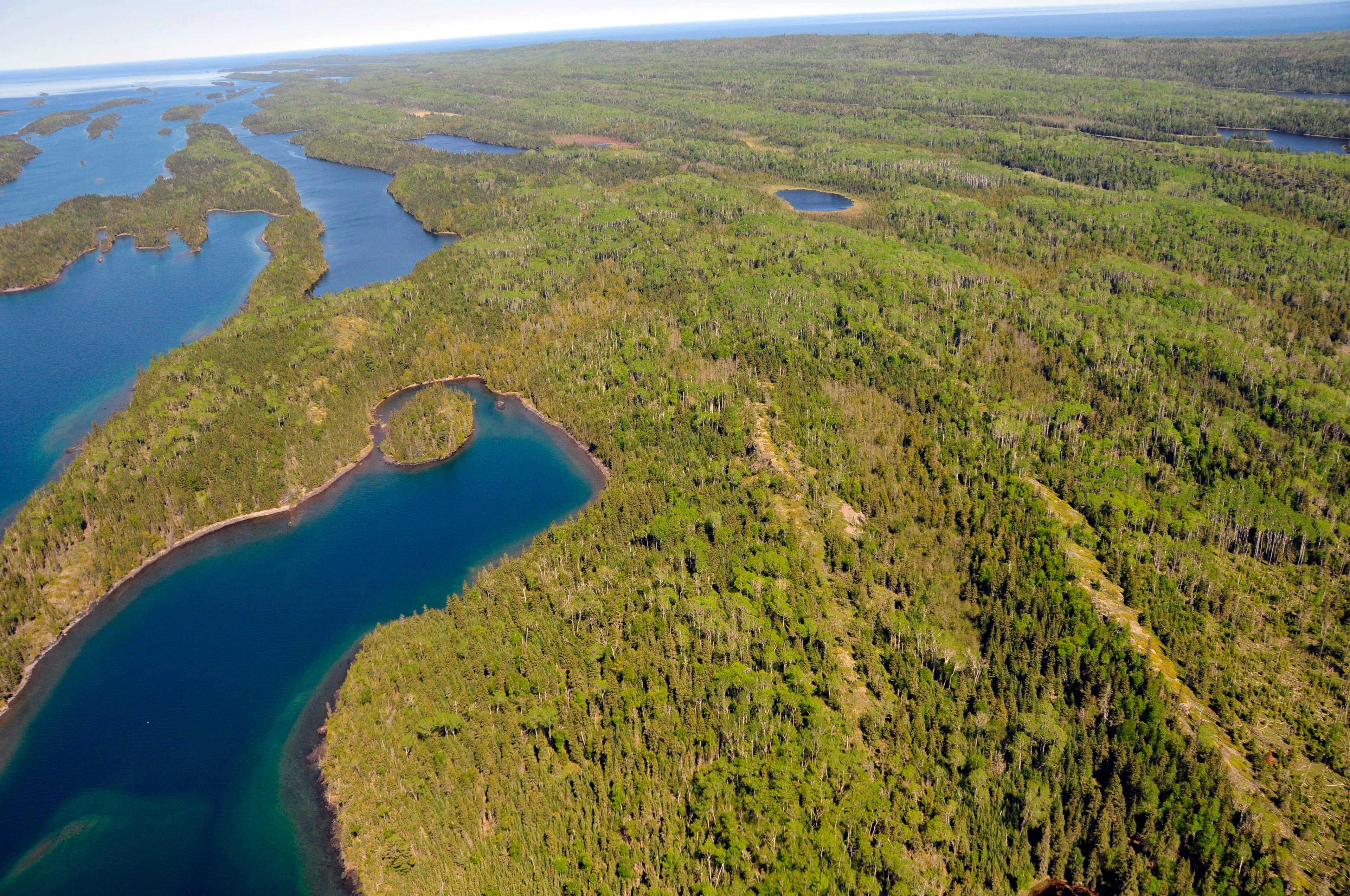 Aerial view of the blue waters of Herring Bay and Pickerel Cove.