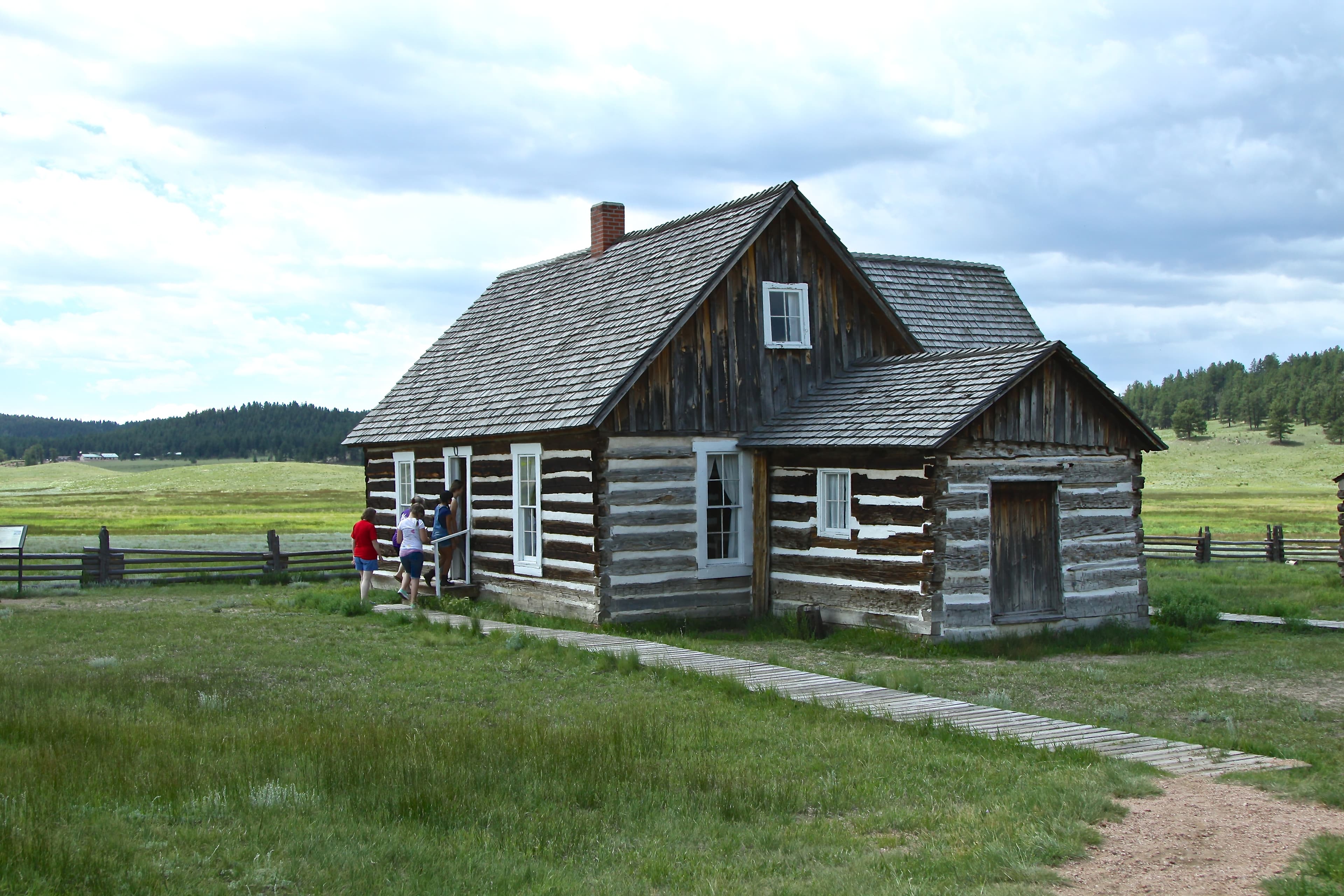 Visitors explore the Hornbek Homestead, built in 1878.