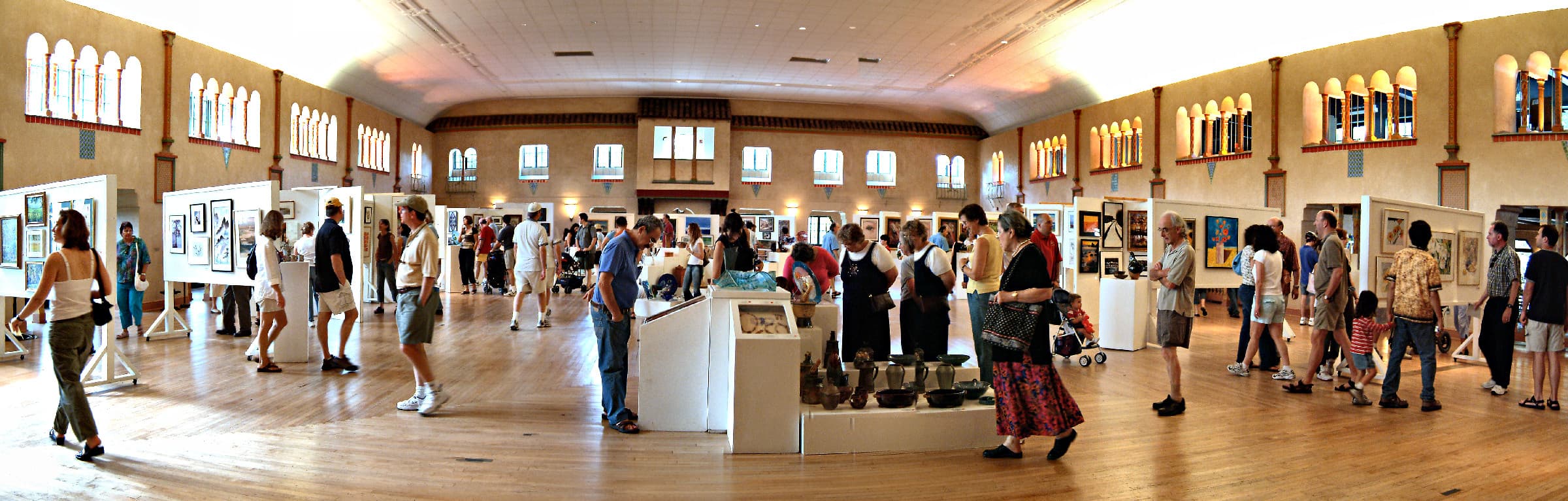 Visitors enjoy the Labor Day Art Show which highlights pieces created by students from the Glen Echo Park art programs.