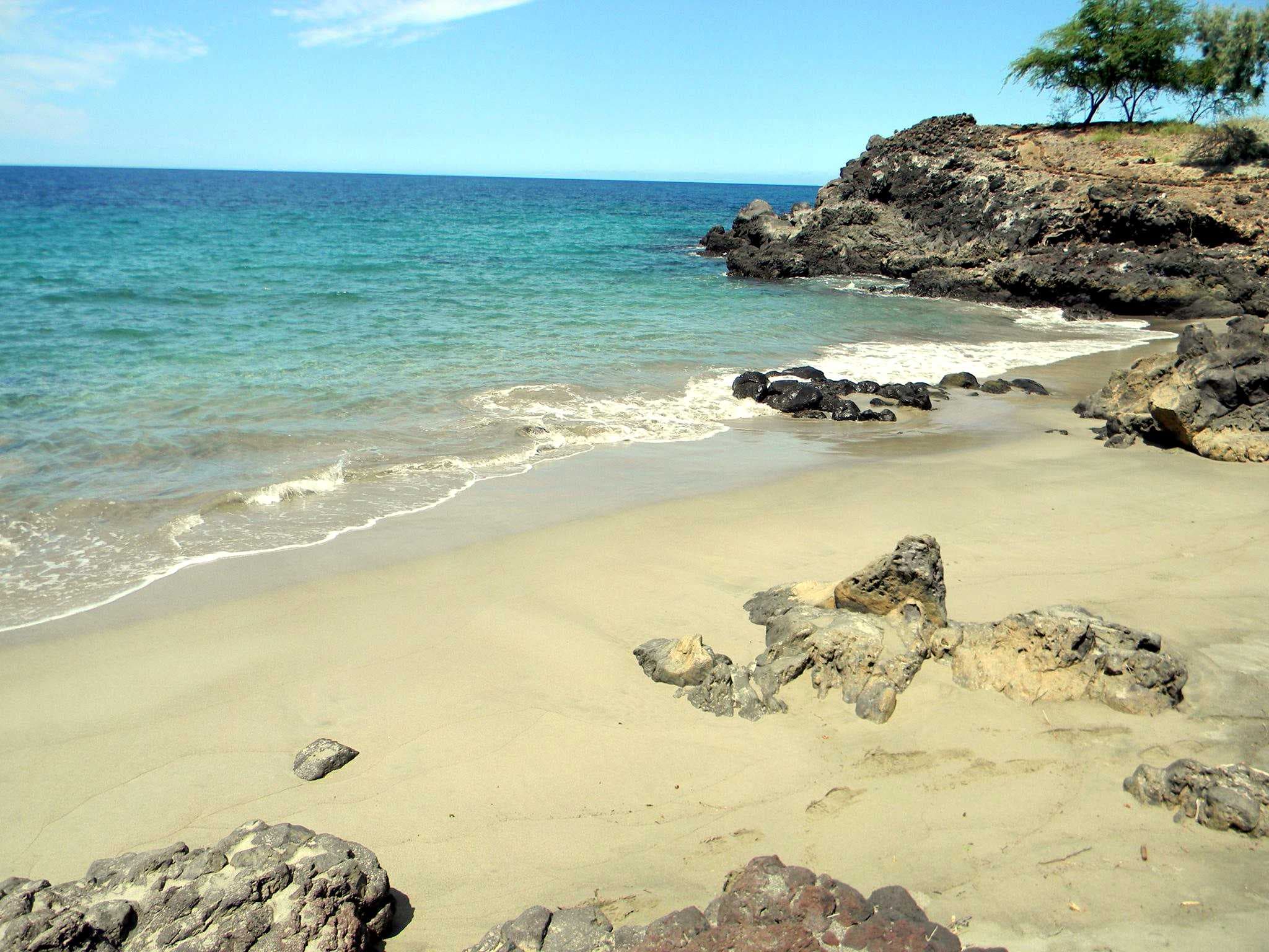 Segments of the Ala Kahakai pass through white sand beaches.