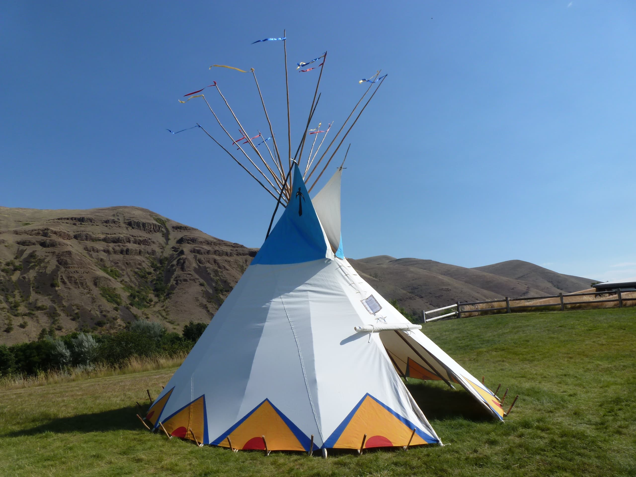 Every morning in the summer Rangers put a tipi on the front lawn of the visitor center. Visitors are always welcome to help.