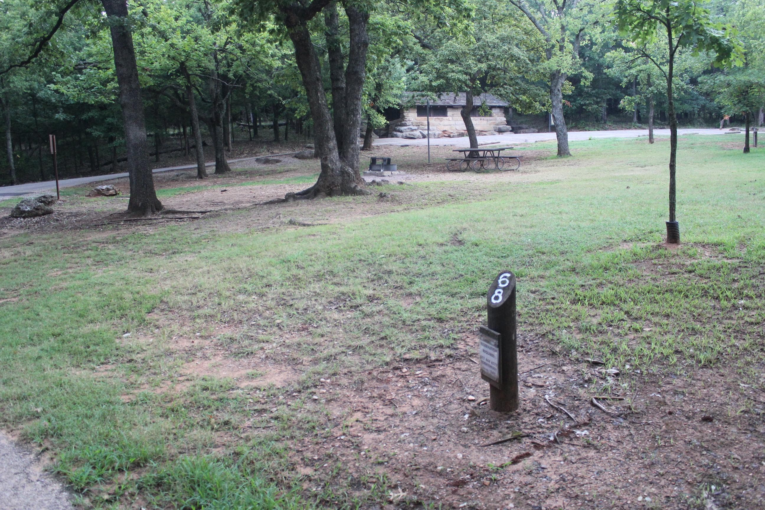 A typical campsite at Central Campground, with the restroom building in the distance.