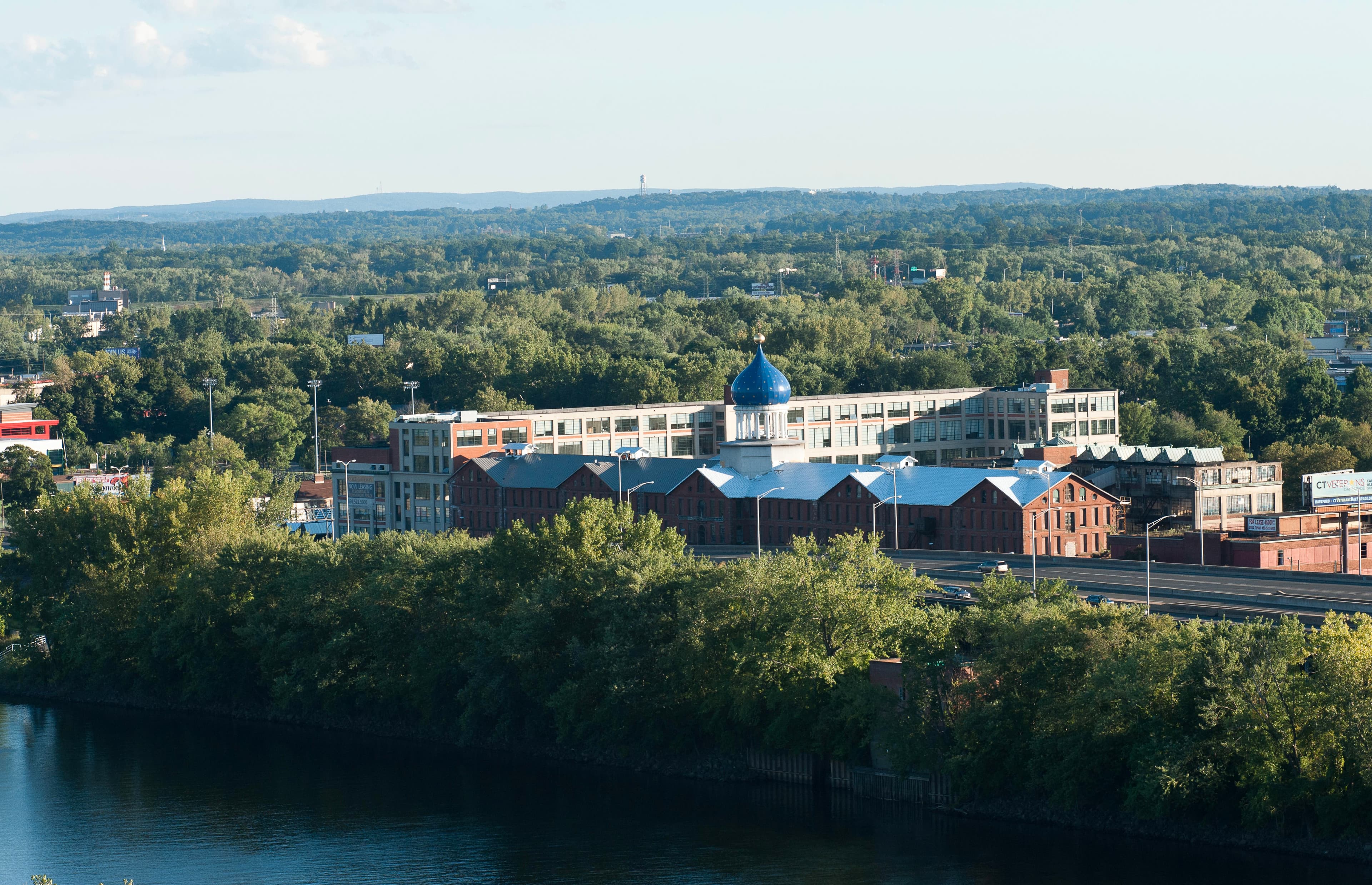 The Colt Armory Complex next to the CT River with its signature Blue Onion Dome