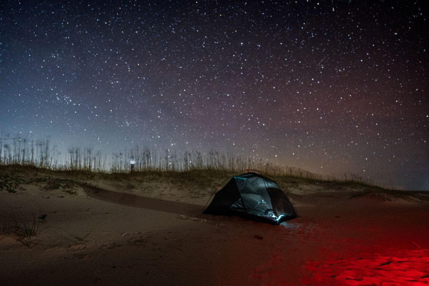 Campers enjoying the preserved night sky at Cape Lookout National Seashore.