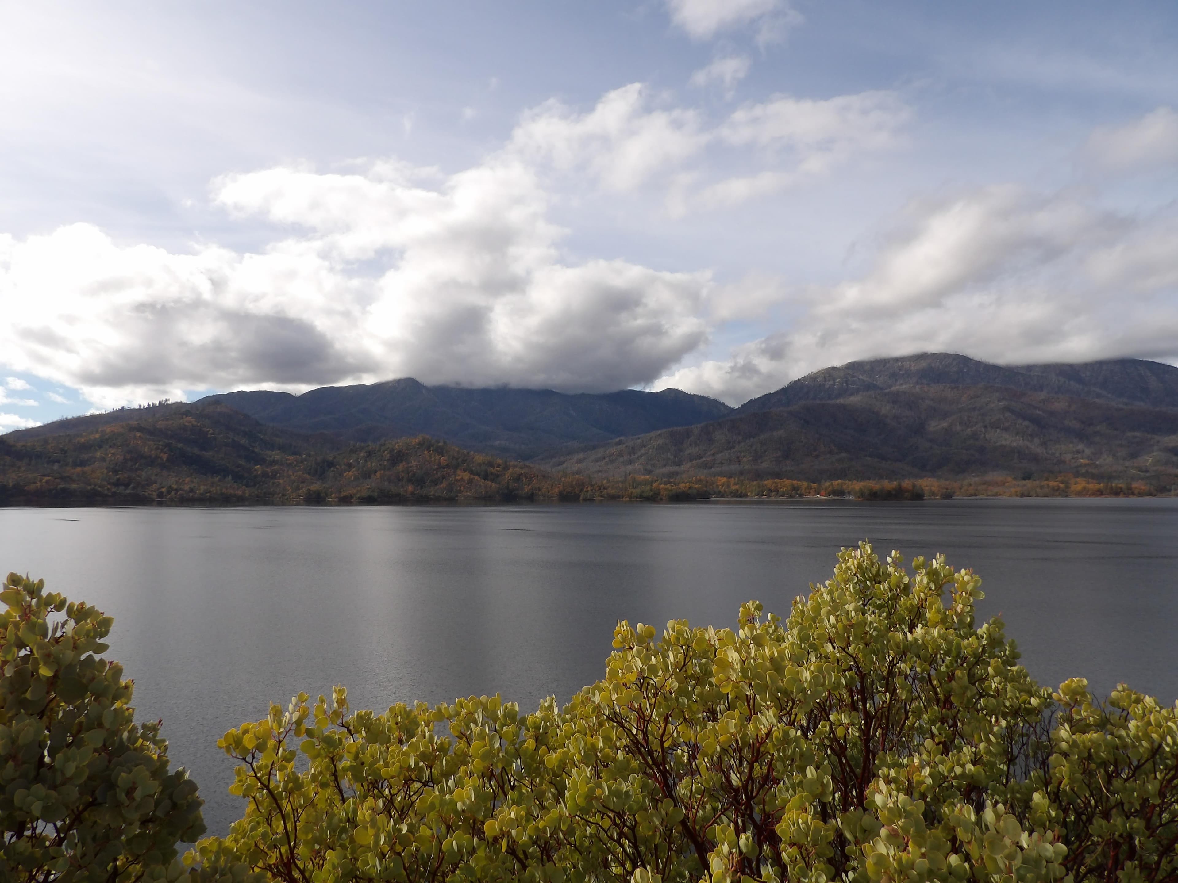 Whiskeytown Lake with the park's tallest mountains in the clouds.